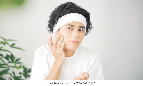 Skin care concept of young Asian man. Men's cosmetics. - Powered by Shutterstock