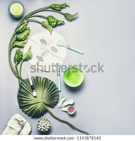 Similar – Skin care cosmetic and facial sheet mask. Various cosmetics product: serum, cream and gel  with tropical leaves and flowers on gray background, top view . Modern beauty concept