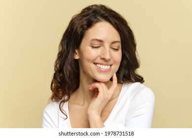 Skin Care. Happy Woman With Beautiful White Smile Touching Clear Pure Face, Enjoy Fresh Face After Salon Cosmetic Treatment. Skincare And Wellness Concept. Portrait Of Relaxed Millennial Female In 30s