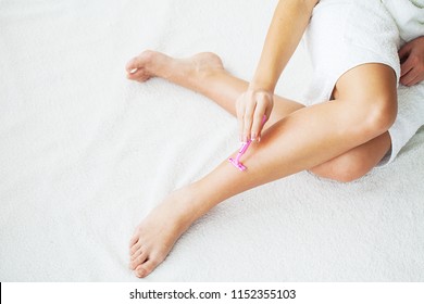 Skin Care And Health. Hair Removal. Fit Woman Shaving Her Legs With Razor.