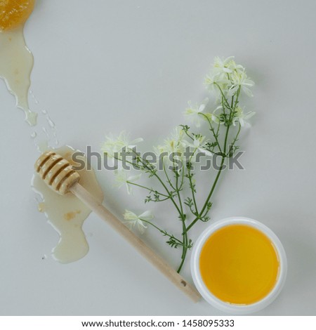 Similar – Image, Stock Photo Honey flows from glass and flowers