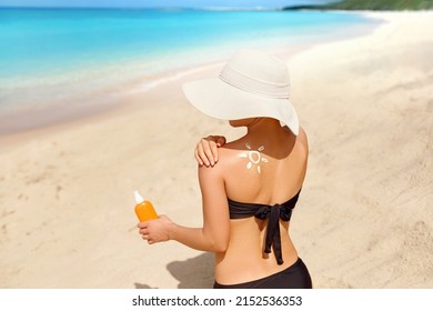 Skin Care. Sun Protection. Beautiful Woman Apply Sun Cream On Face. Woman With Suntan Lotion On Beach