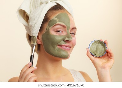 Skin Care. Woman Applying With Brush Clay Mud Mask To Her Face. Girl Taking Care Of Oily Complexion. Beauty Treatment.