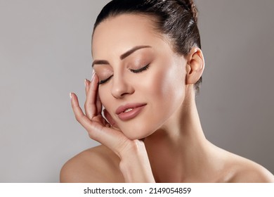 Skin Care. Woman With Beauty Face Touching Healthy Facial Skin Portrait. Beautiful Smiling Girl Model With Natural Makeup Touching Her Skin.