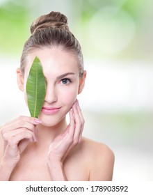 Skin Care Woman Face With Green Leaf, Concept For Skin Care Or Organic Cosmetics