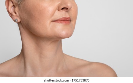 Skin Lifting. Cropped Image Of Mature Woman With Smooth Skin Over Light Background, Closeup