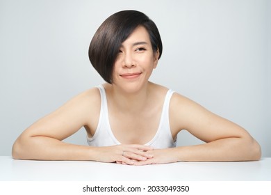 Skin Radiance Concept. Portrait Of A Beautiful 30s Asian Woman In White Inner Wear With Flawless Face, Shiny Healthy Hair. K-beauty, Collagen, Products, Clinic, Plastic Surgery, V Shape, Skincare, 40s