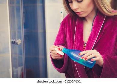 Skin Toning, Proper PH Complexion Concept. Woman Applying Tonic On Cotton Pad