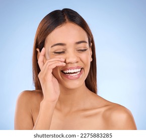 Skincare, beauty and happy woman with smile in studio for skin glow promo with hand on face on blue background. Makeup, facial and cosmetics, African model for dermatology or spa promotion and mockup - Shutterstock ID 2275883285