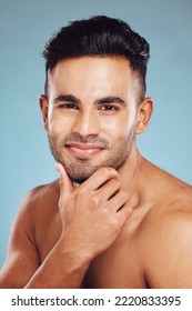 Skincare, Beauty And A Portrait Of Man, Topless Touching Beard With Healthy Skin And Natural Facial Glow And Smile On Face In India. Male Body Care, Health And Model In Studio With Blue Background.