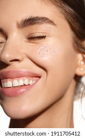 Skincare Beauty. Young Woman With Happy Smile, Using Facial Hydrate Skin Product. Girl With No Makeup, Applying Scrub Or Face Cream With Collagen And Tea Tree Leaf Ingredients. Close Up.