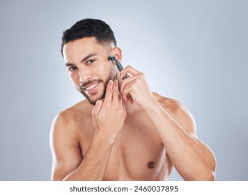 Skincare, body and portrait of man shaving face in studio for wellness, hygiene and cosmetic treatment on grey background. Happy, beauty and Mexican model with facial, hair removal and razor blade