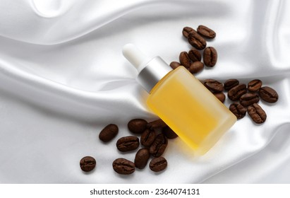 Skincare caffeine eye serum. Product bottle and coffee beans.   Caffeine skincare.  - Shutterstock ID 2364074131