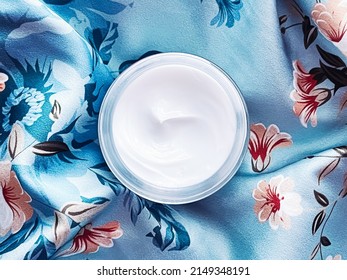 Skincare Cosmetics, Face Cream Moisturiser Jar On Blue Floral Background, Beauty Product Flatlay Close-up