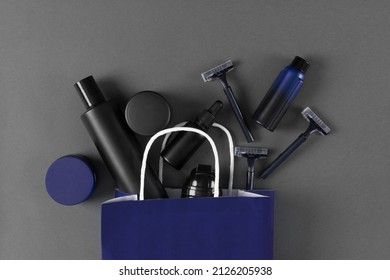 Skincare Cosmetics For Men In Paper Bag. Male Grooming Cosmetic Products On Grey Background. Top View, Flat Lay