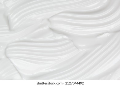Skincare cream texture. White cosmetic lotion background. Creamy gel, moisturiser, makeup product swatch macro