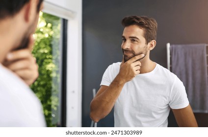 Skincare, mirror and happy man in house with hands on face for beard, growth inspection or facial hair. Bathroom, check and male person with reflection for cleaning, beauty glow and grooming results - Powered by Shutterstock