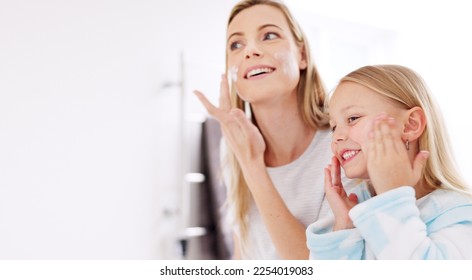 Skincare, mother and girl with cream, for natural beauty and bonding together in bathroom. Mama, daughter or child being happy, smile for cosmetics, organic facial and lotion for smooth skin and glow - Powered by Shutterstock