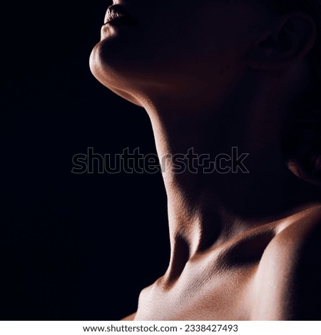 Skincare, neck and person on black background for creative lighting, shadow and silhouette. Aesthetic, beauty and closeup of body in dark studio with macro of skin for art deco, wellness and glow