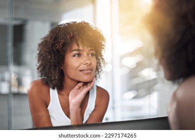 Skincare, woman and bathroom mirror face check after cometic, treatment and cleaning in her home. Beauty, glow and female touching her skin after facial, grooming and smile with results satisfaction - Powered by Shutterstock