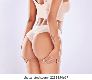 Skincare, woman beauty and butt in a studio with wellness, underwear and fitness. Cosmetics, liposuction and bum cellulite treatment of a female body with isolated white background and cosmetology