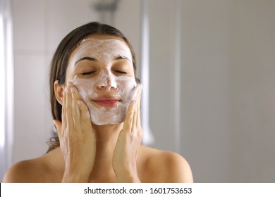 Skincare Woman Washing Face  Foaming Facewash Soap Scrub On Skin. Face Wash Exfoliation Scrub Soap Woman Washing Scrubbing With Skincare Cleansing Product. Enjoying Relaxing Time.