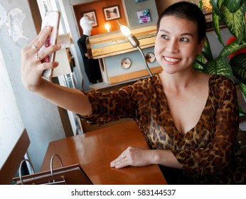 The Skinhead Woman Is Selfieing