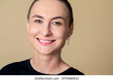 Skinhead Woman Smiling In Studio Shoot