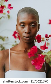 Skinhead Woman Surrounded By Red Flowers