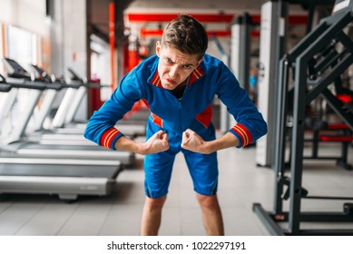 Skinny Man In Sportswear Shows His Muscles, Gym