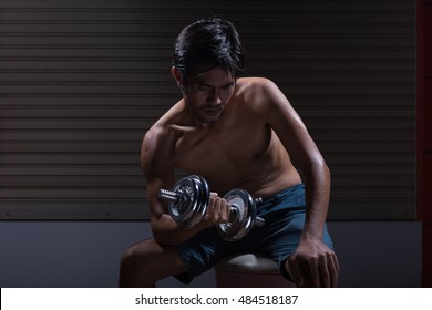 Skinny Man Training His Muscle