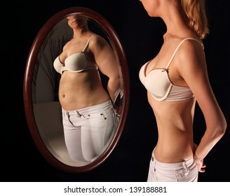 Skinny Woman Seeing Herself Fat In A Mirror