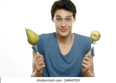 Skinny Young Man Eating An Organic Healthy Salad And A Juicy Pear. Green Food For A Healthy Life And A Perfect Diet