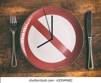 Skip Breakfast Concept With No Symbol And Clock On Plate