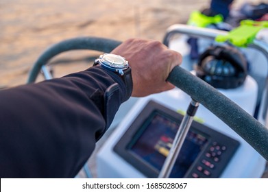 Skipper's Arm At The Helm And Sailing Boat Navigation Equipment. Scotland Waters.