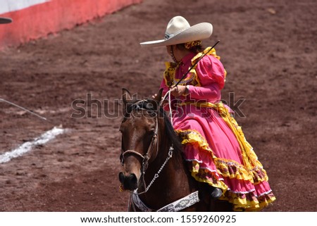 Skirmishers Mexican horse riders in
rodeo