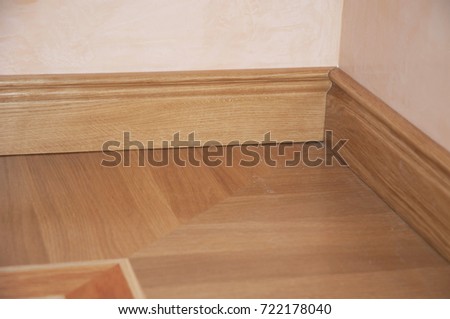 Skirting Board & Architrave. Wood Flooring. Skirting Board Oak Wooden Floor . Flooring with Wooden Batten Repair.