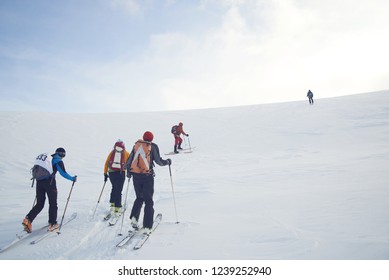 Skitouring Group With Mountain Views In Winter