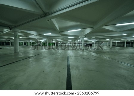 A Skoda Fabia parking alone in an empty car park at night