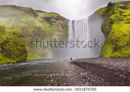 Skogafoss waterfall with human as a scale, Skogar, Iceland