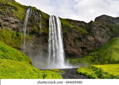 Skogafoss waterfall,The biggest waterfall in Skogar,Iceland Waterfall with green mountain.