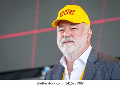 SKOLKOVO, MOSCOW, RUSSIA. May 29, 2019. Russian Jewish businessman Victor Vekselberg in a yellow cap speaking at the Skolkova Startup Village annual international innovations conference opening event.
