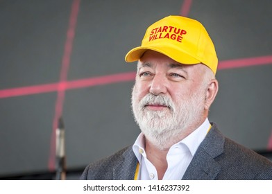 SKOLKOVO, MOSCOW, RUSSIA. May 29, 2019. Russian Jewish businessman Victor Vekselberg in a yellow cap speaking at the Skolkova Startup Village annual international innovations conference opening event.