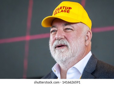 SKOLKOVO, MOSCOW, RUSSIA. May 29, 2019. Russian Jewish businessman Victor Vekselberg in a yellow cap speaking at the Skolkova Startup Village annual international innovations conference opening event.