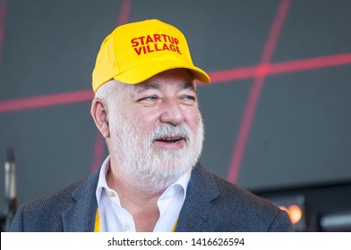 SKOLKOVO, MOSCOW, RUSSIA. May 29, 2019. Russian Jewish businessman Victor Vekselberg in a yellow cap speaking at the Skolkova Startup Village annual international innovations conference opening event.
