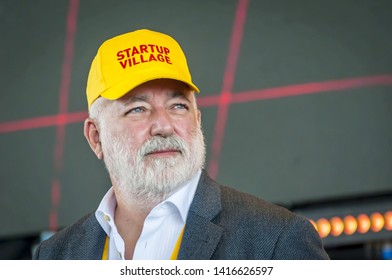 SKOLKOVO, MOSCOW, RUSSIA. May 29, 2019. Russian Jewish businessman Victor Vekselberg in a yellow cap speaking at the Skolkova Startup Village annual international innovations conference opening event.
