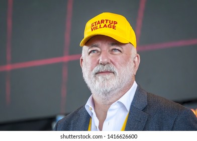 SKOLKOVO, MOSCOW, RUSSIA. May 29, 2019. Russian Jewish businessman Victor Vekselberg in a yellow cap speaking at the Skolkova Startup Village annual international innovations conference opening event.