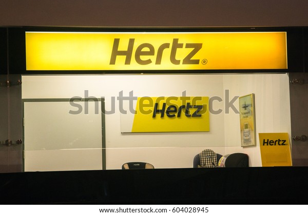 Skopje, Macedonia, march 16, 2017: Hertz\
car rental office in Macedonia airport. Hertz is one of largest car\
rental companies. It was founded in\
1918.