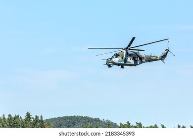 SKRYJE, CZECH REPUBLIC - July 19, 2011: Military Helicopter Of The Czech Army Mi-24 Flying In The Valley Of The River 