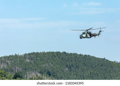 SKRYJE, CZECH REPUBLIC - July 19, 2011: Military Helicopter Of The Czech Army Mi-24 Flying In The Valley Of The River 